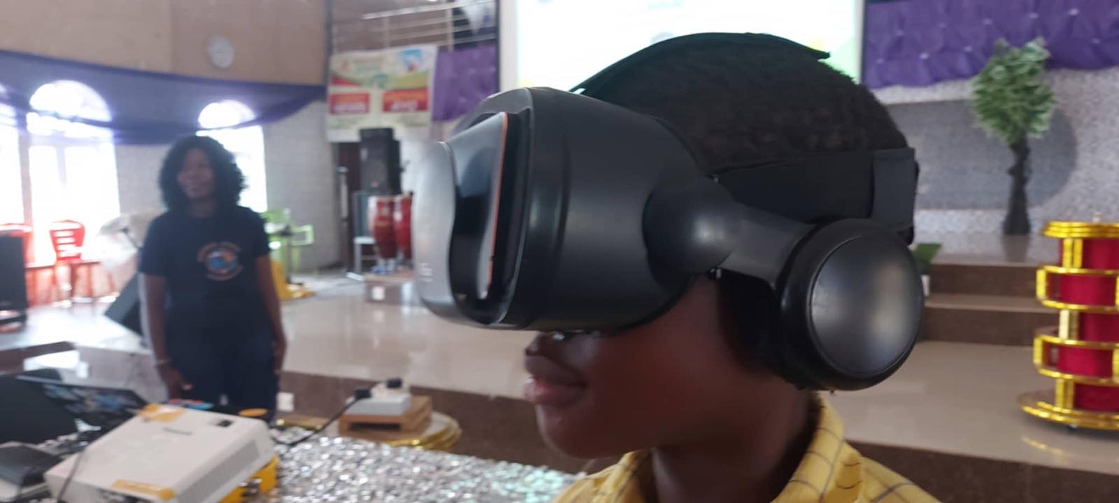 A pupil trying a virtual reality headset