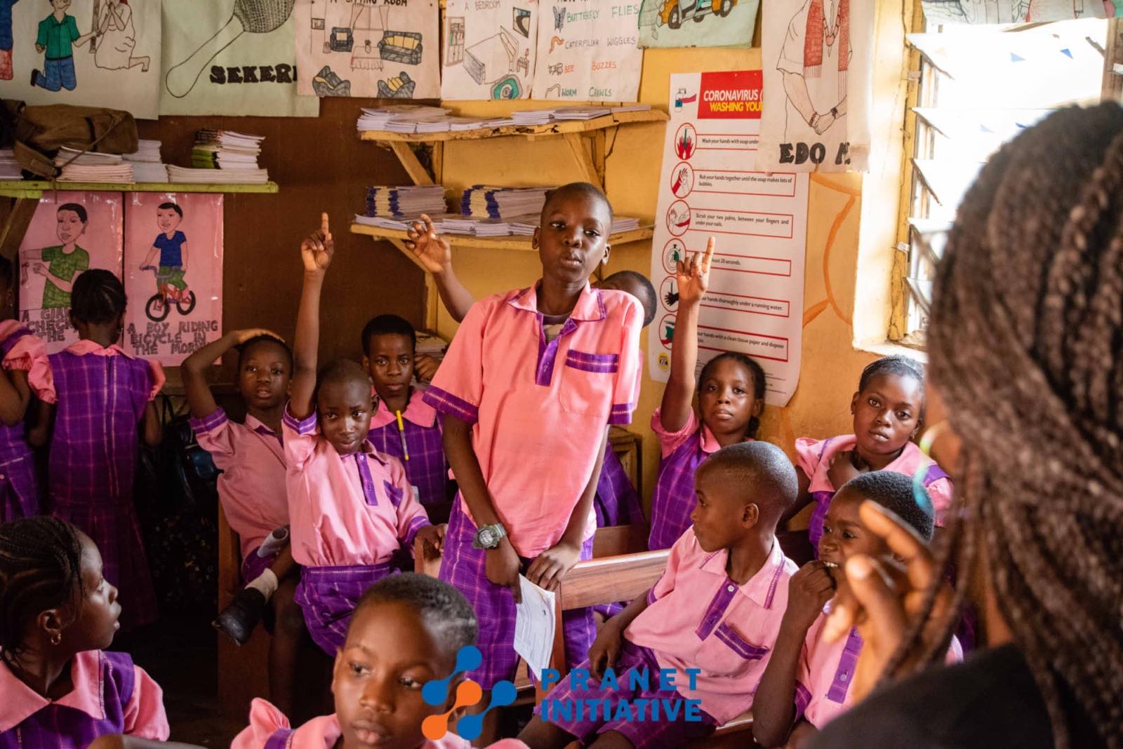A pupil standing to answer in class