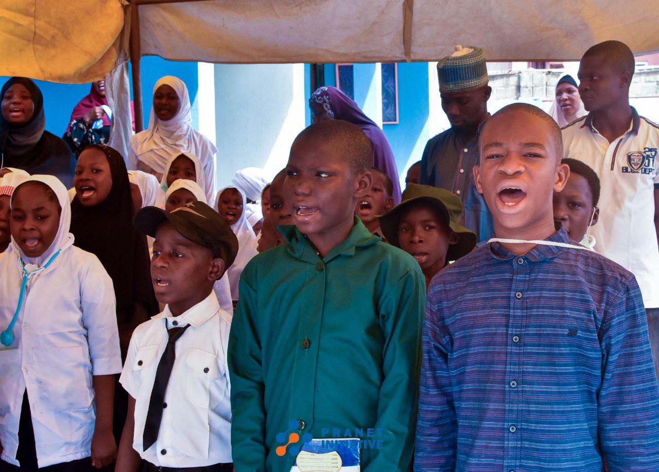 Pupils and teachers at a school assembly